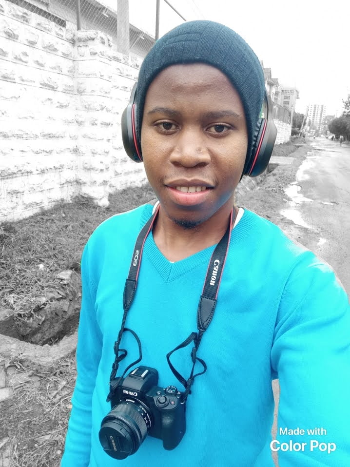 A picture of Dennis Ohuru, vlogging for his YouTube channel